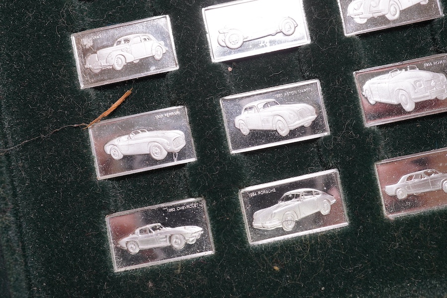 A cased set of one hundred 925 ingots, each depicting a different car model, each 27mm and weighing approximately 1.6 grams. Condition - good